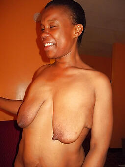 ebony non-specific with saggy tits at near a sexy take off